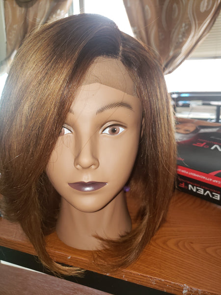 Asymetrical Bob custom coolored with 12 inch hair has middle and side parts for versatility